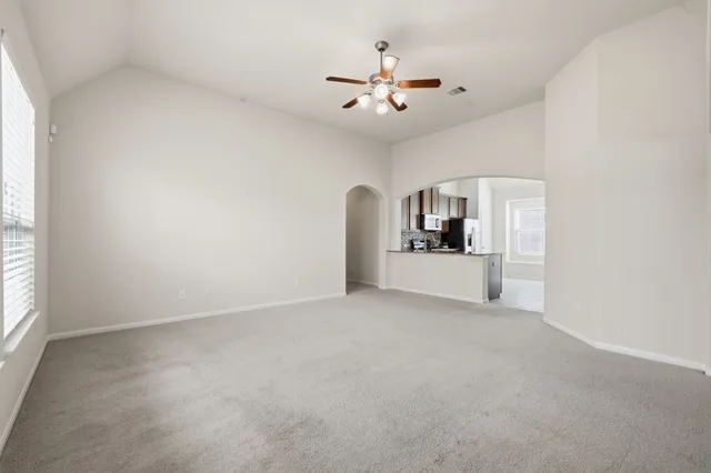 a kitchen with stainless steel appliances granite countertop a stove a refrigerator and a sink