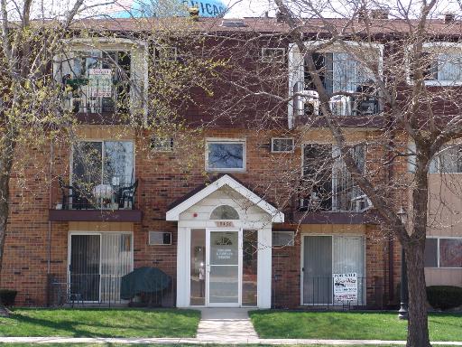 10430 South Ridgeland Avenue, Unit 9 Chicago Ridge, IL 60415 - Photo 1 of 1 front view of a house with a yard