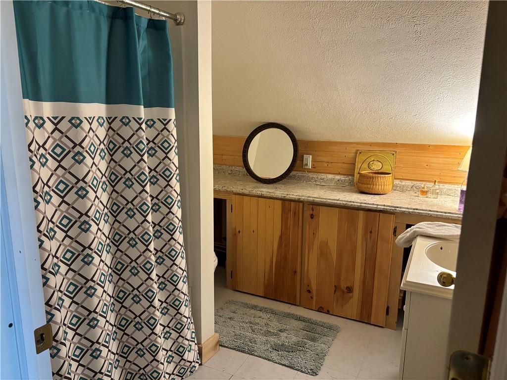0 State Route 2006 Rural Valley, PA 16249 - Photo 13 of 28 a bathroom with a granite countertop sink and a mirror