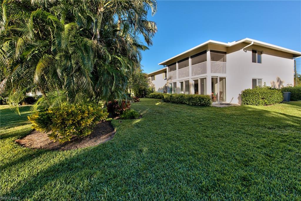 865 Teryl Road, Unit 2114 Naples, FL 34112 - Photo 20 of 26 a view of a house with a yard