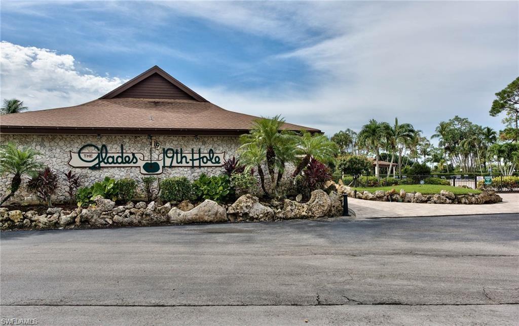 865 Teryl Road, Unit 2114 Naples, FL 34112 - Photo 24 of 26 front view of a house with a yard