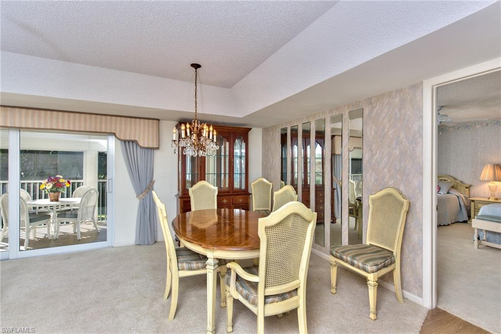 865 Teryl Road, Unit 2114 Naples, FL 34112 - Photo 7 of 26 a dining room with furniture and window