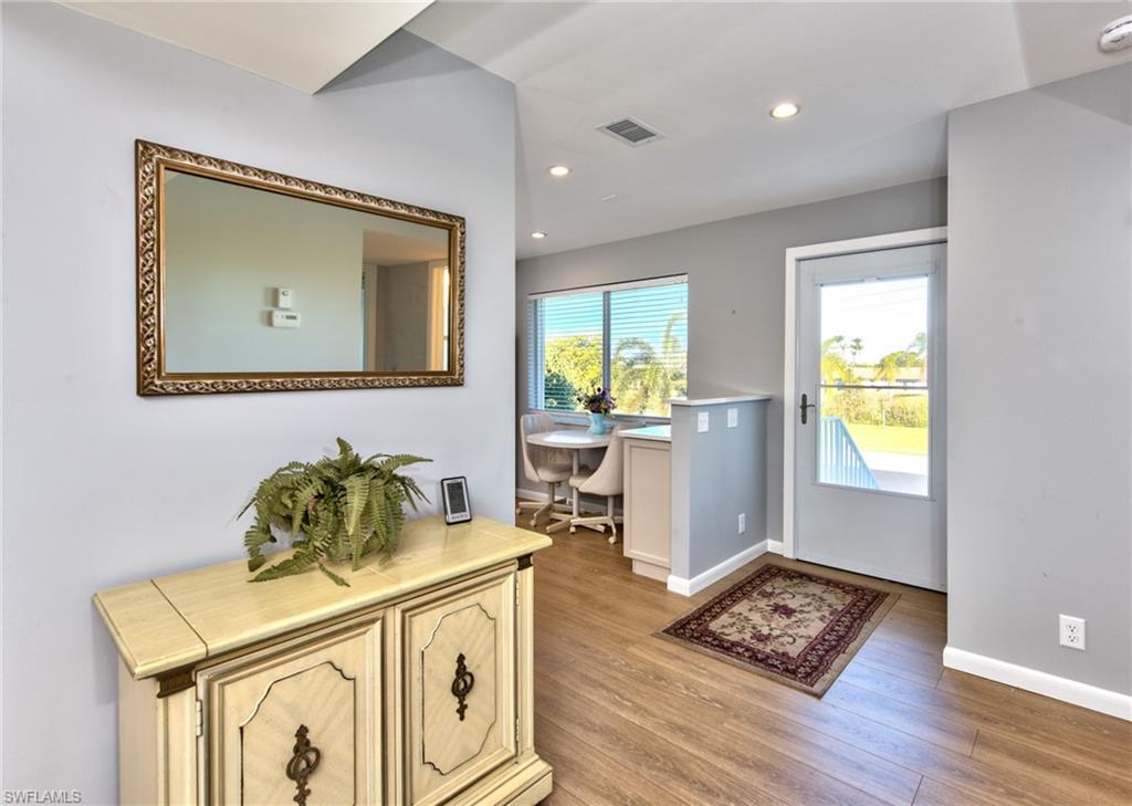 865 Teryl Road, Unit 2114 Naples, FL 34112 - Photo 9 of 26 a view of livingroom with furniture and wooden floor