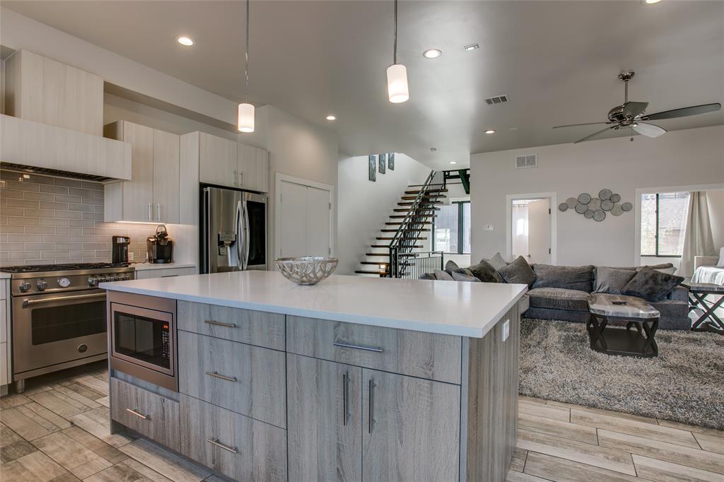 410 Melba Street, Unit 2 Dallas, TX 75208 - Photo 20 of 40 a kitchen with stainless steel appliances granite countertop a sink stove and refrigerator