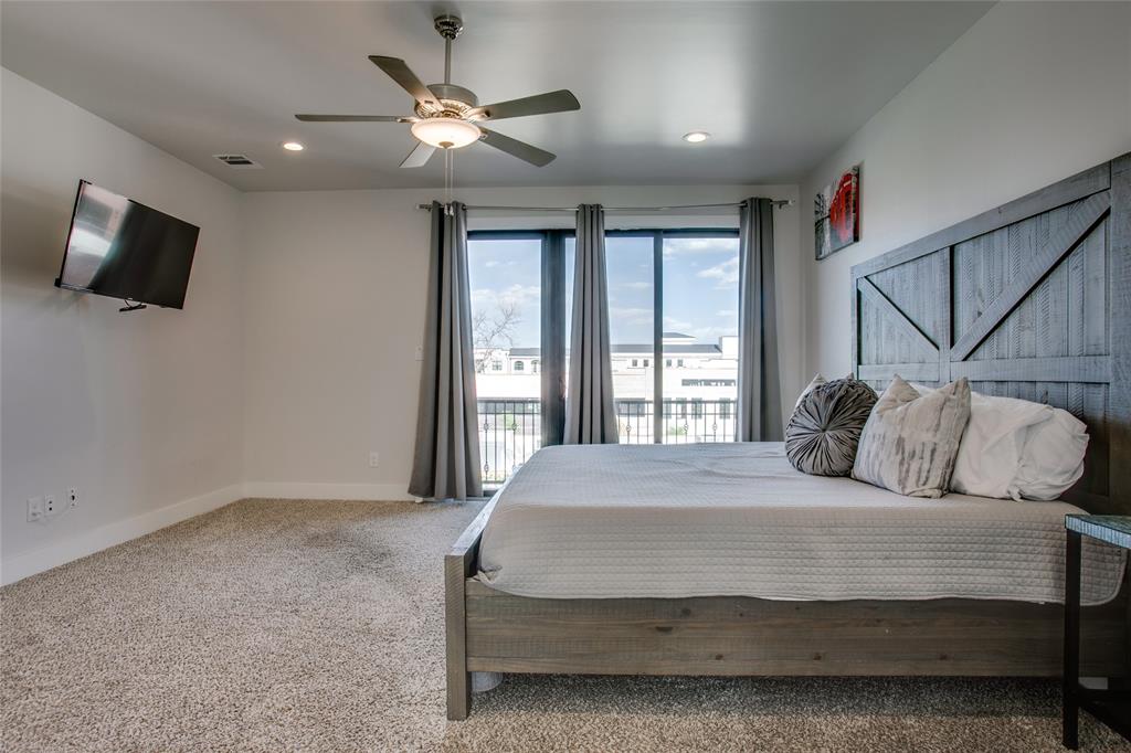 410 Melba Street, Unit 2 Dallas, TX 75208 - Photo 25 of 40 a bedroom with a bed and a flat screen tv