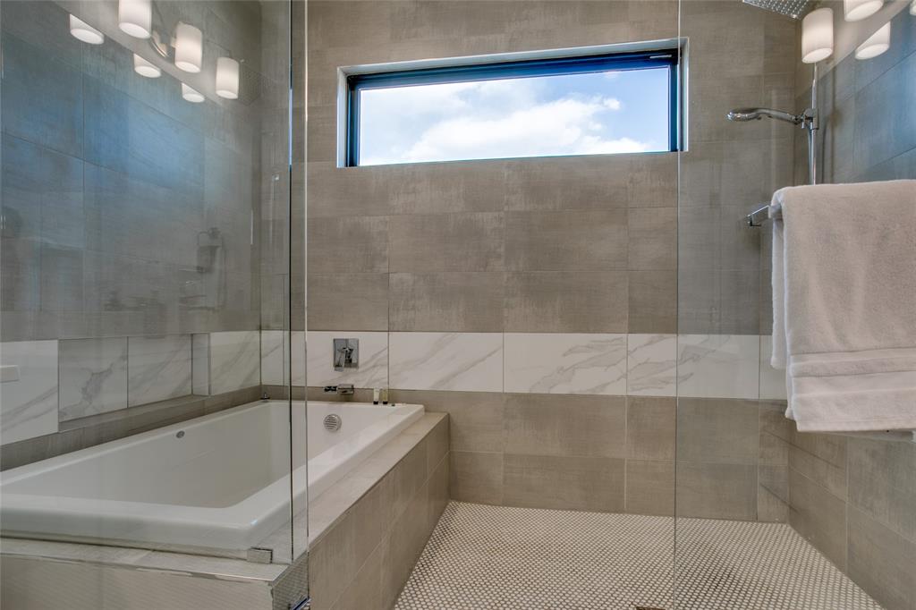 410 Melba Street, Unit 2 Dallas, TX 75208 - Photo 27 of 40 a bathroom with a bathtub and shower
