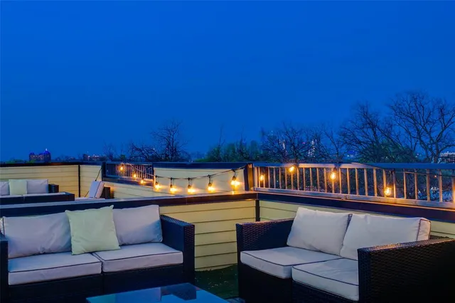a reading room with furniture and a wooden floor