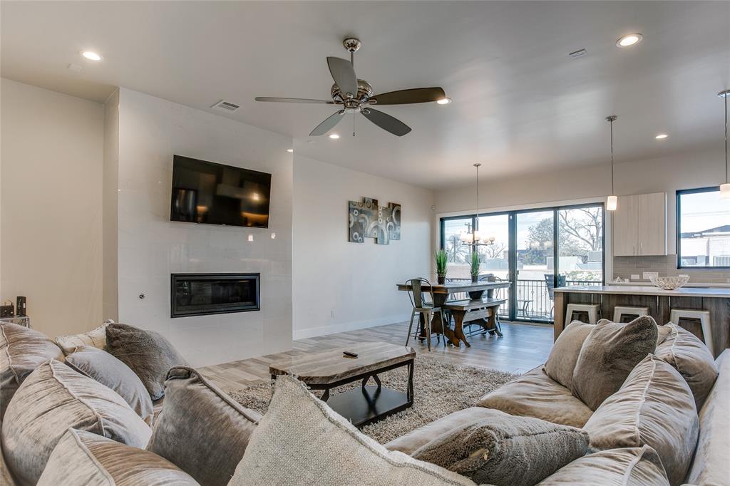 410 Melba Street, Unit 2 Dallas, TX 75208 - Photo 4 of 40 a living room with furniture fireplace and a flat screen tv
