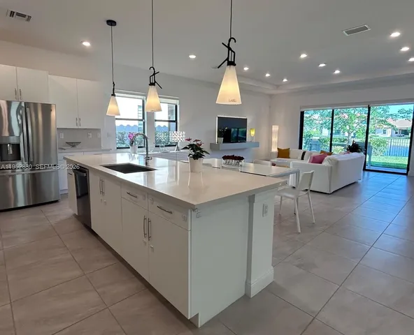 $1,030,000 | 12160 North Baypoint Circle, Parkland, FL 33076