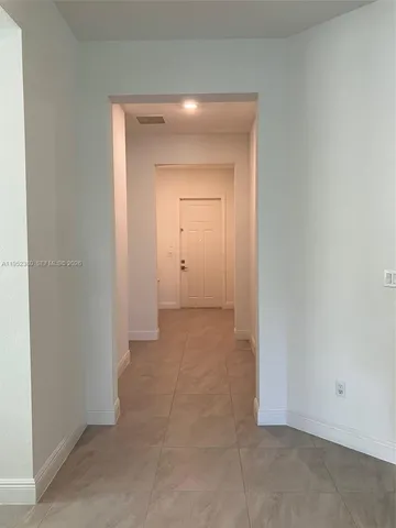 a view of an empty room with a bathroom