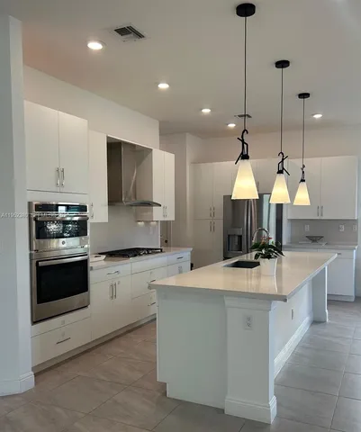 $1,030,000 | 12160 North Baypoint Circle, Parkland, FL 33076