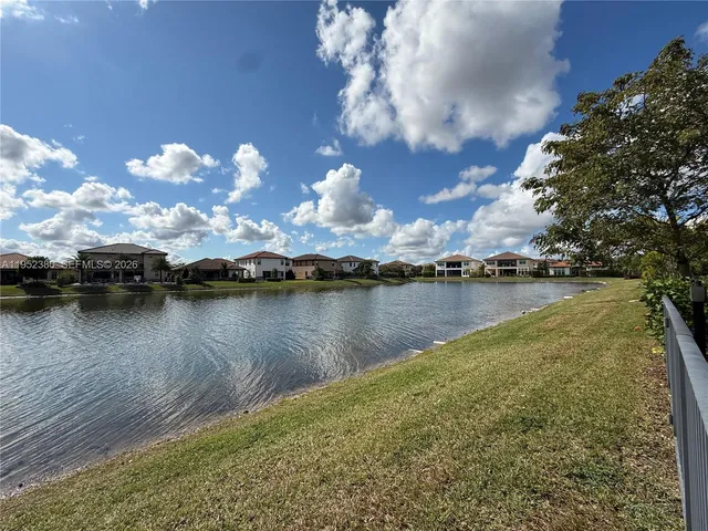 a view of a lake in middle of forest