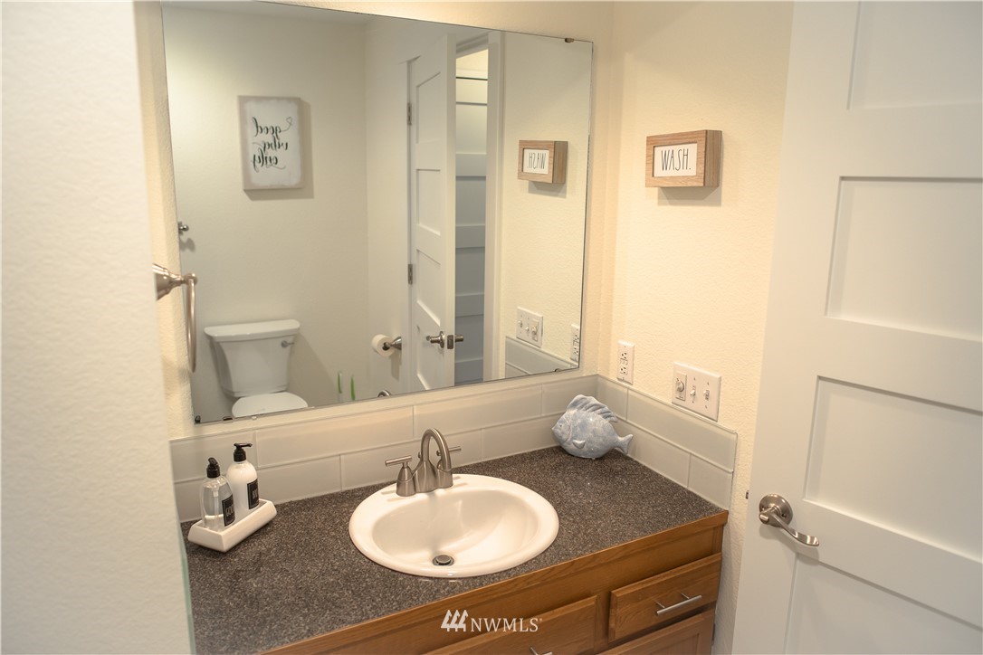 3733 Waller Road East, Unit 301 Tacoma, WA 98443 - Photo 15 of 17 a bathroom with a sink toilet and shower