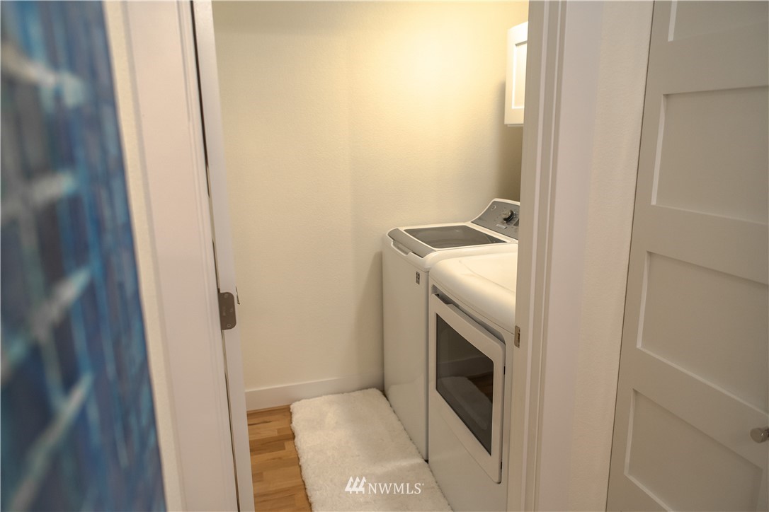 3733 Waller Road East, Unit 301 Tacoma, WA 98443 - Photo 16 of 17 a bathroom with a sink and washing machine