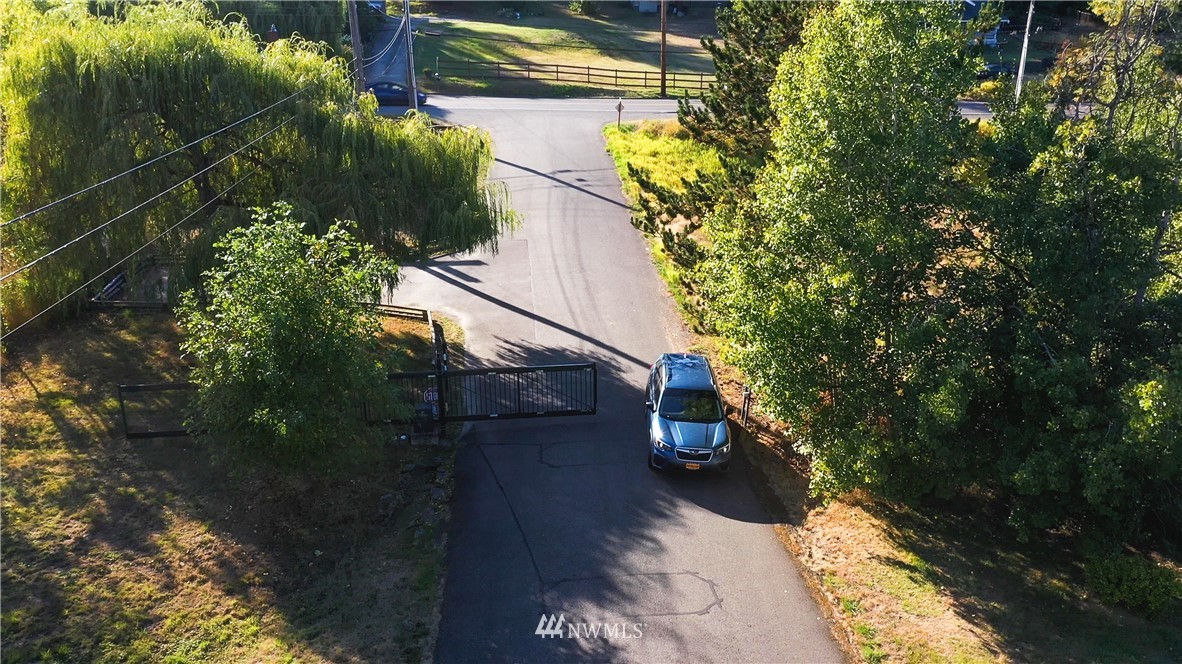3733 Waller Road East, Unit 301 Tacoma, WA 98443 - Photo 3 of 17 a view of street along with trees