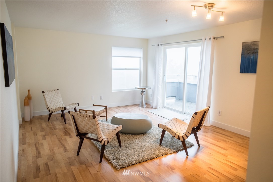 3733 Waller Road East, Unit 301 Tacoma, WA 98443 - Photo 4 of 17 a living room with furniture and a window