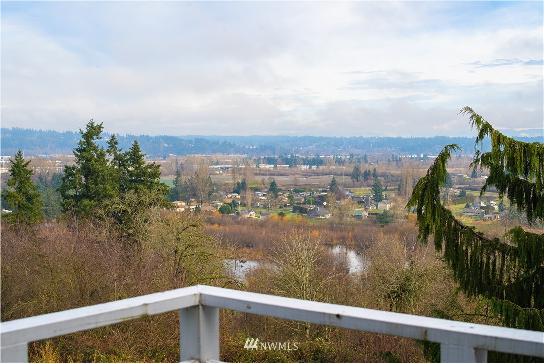 3733 Waller Road East, Unit 301 Tacoma, WA 98443 - Photo 7 of 17 a view of a lake from a balcony