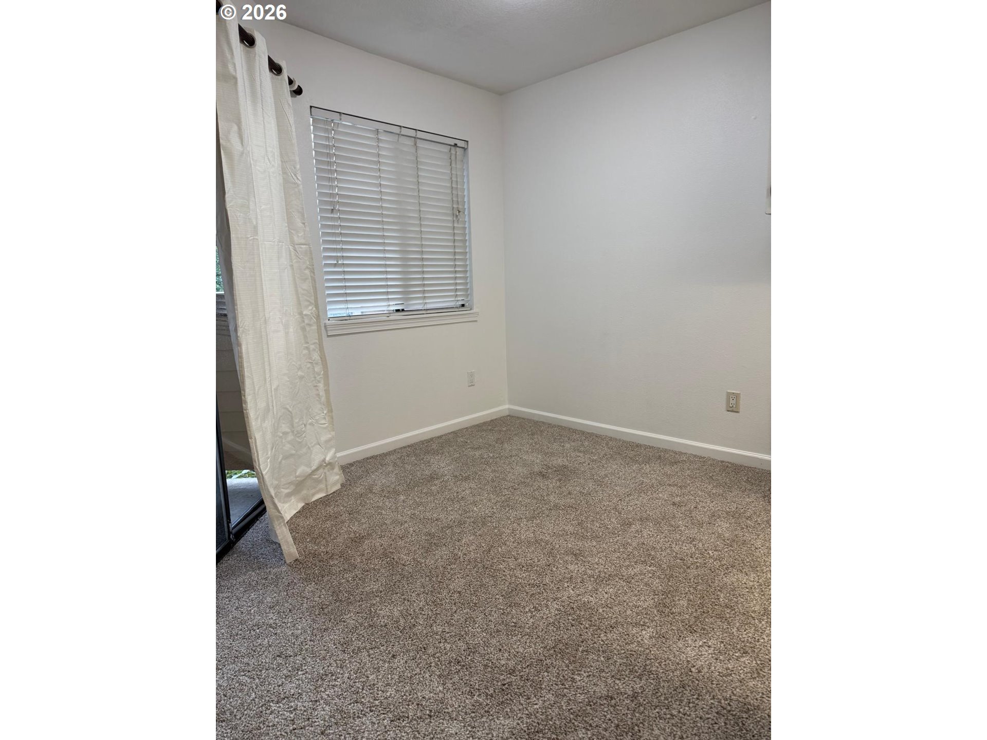 9987 Southeast Talbert Street Clackamas, OR 97015 - Photo 11 of 14 a view of an empty room with windows