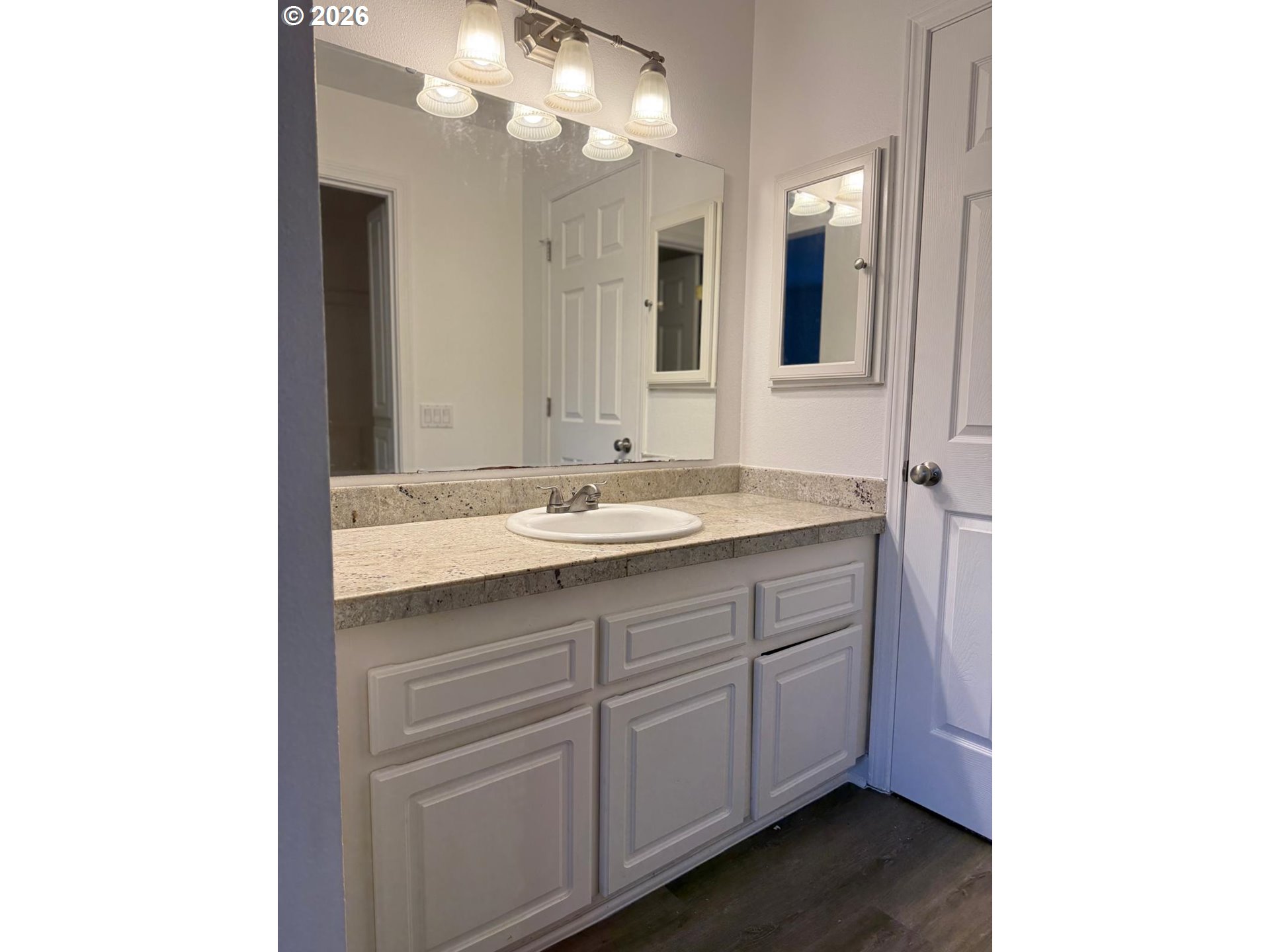 9987 Southeast Talbert Street Clackamas, OR 97015 - Photo 12 of 14 a bathroom with a sink and a mirror