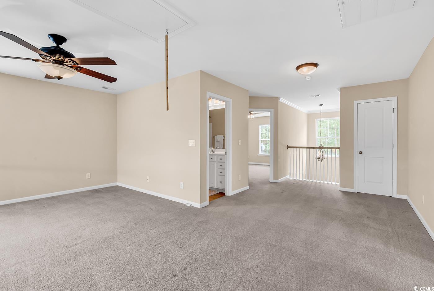 126 Dreamland Drive Murrells Inlet, SC 29576 - Photo 23 of 40 Spare room with attic access, ceiling fan, and carpet floors