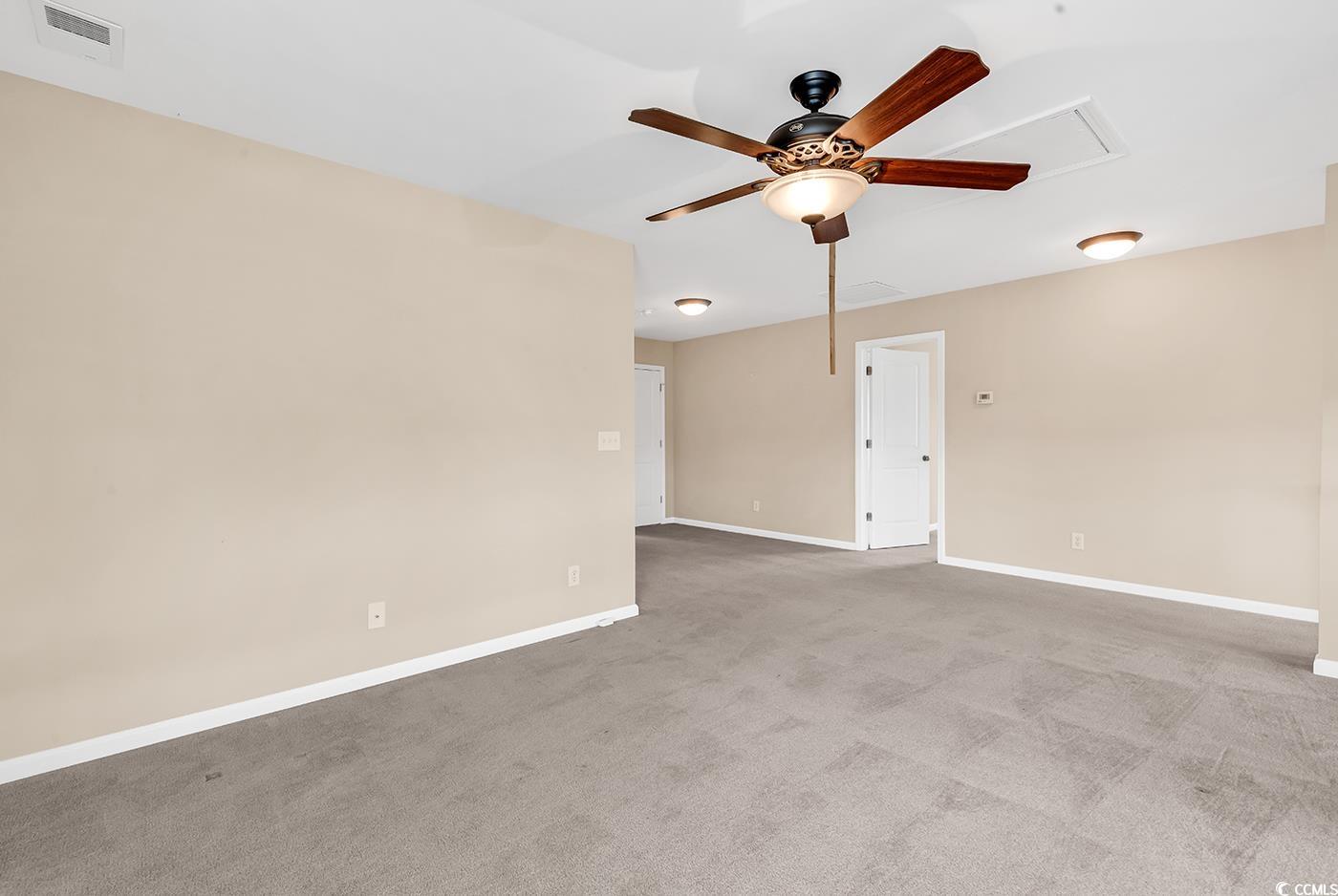 126 Dreamland Drive Murrells Inlet, SC 29576 - Photo 25 of 40 Carpeted spare room with attic access, ceiling fan, and baseboards