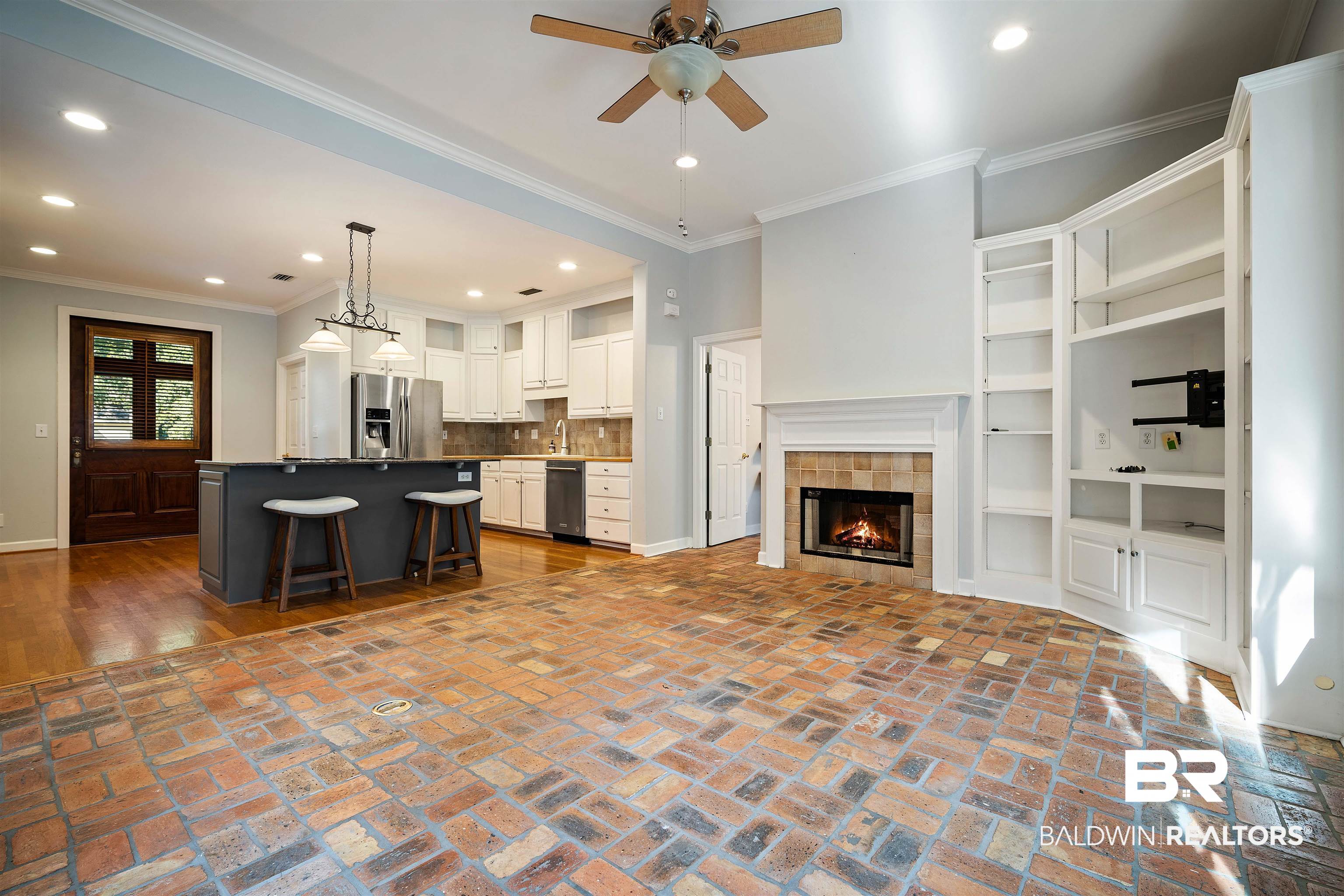 204 General Canby Loop Daphne, AL 36527 - Photo 8 of 36 Living room with ceiling fan, ornamental molding, sink, and a tiled fireplace