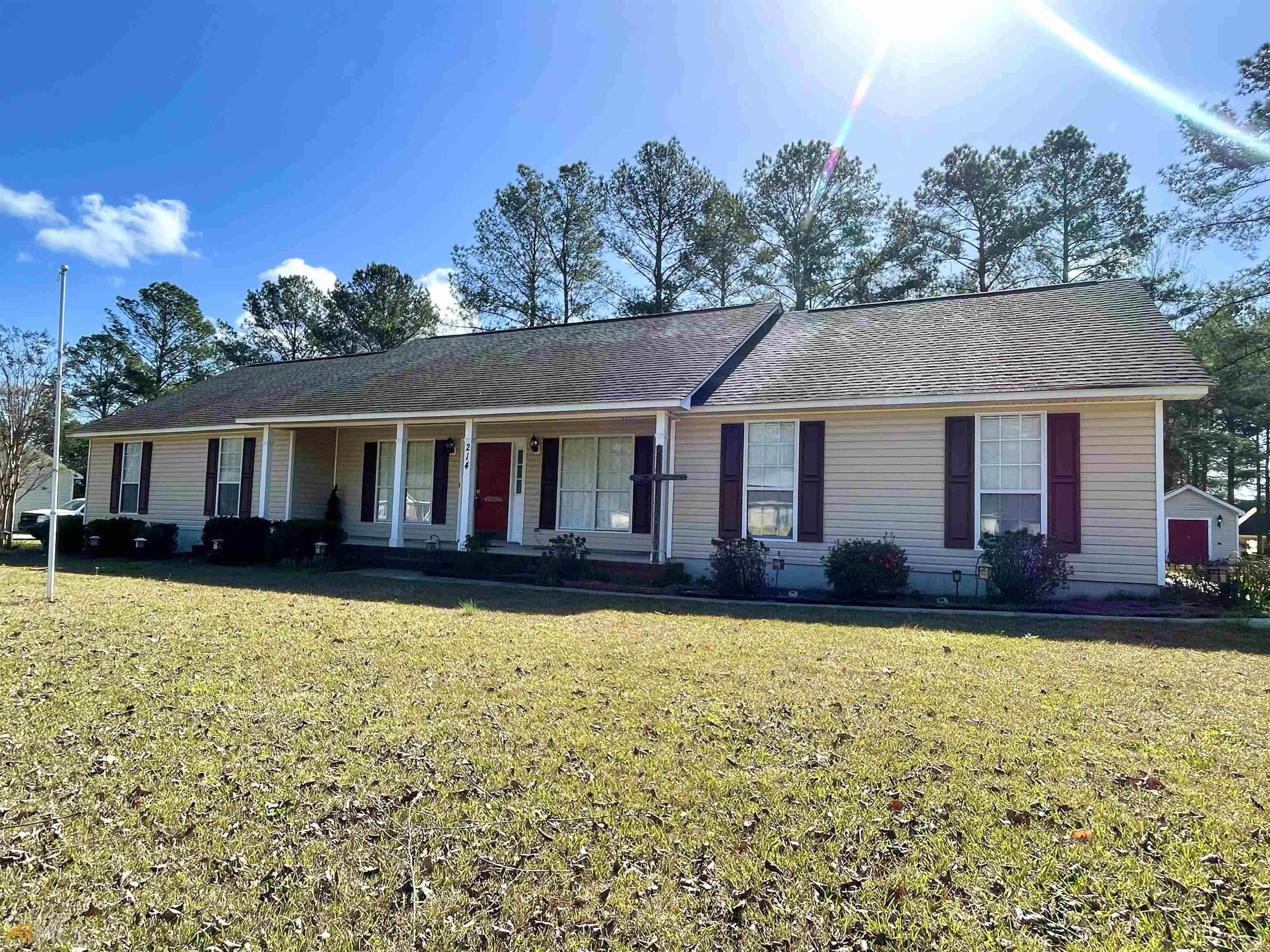 214 Barfield Drive Dublin, GA 31021 - Photo 1 of 1 a view of a house with swimming pool and sitting area