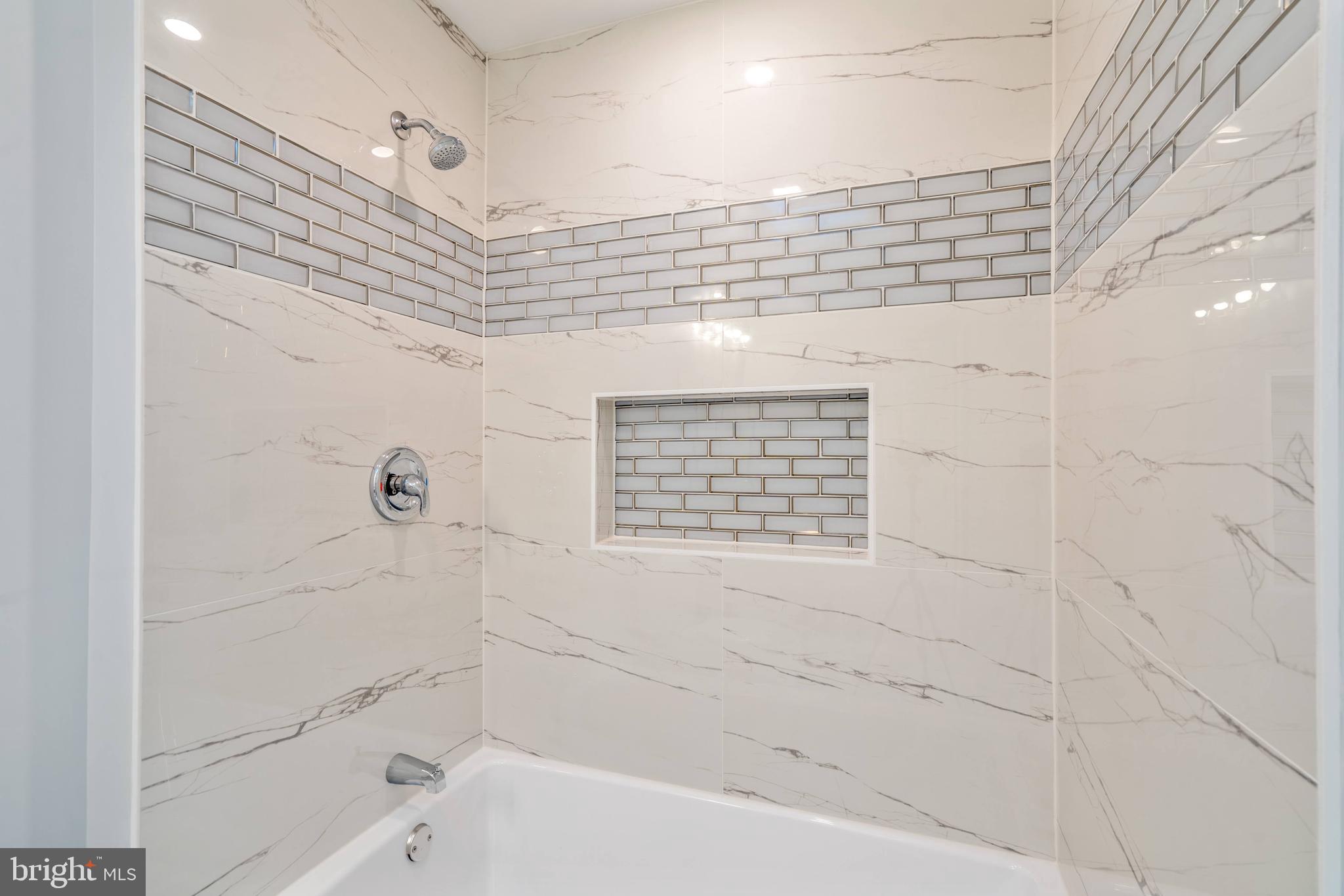 104 Ridge Avenue Baltimore, MD 21227 - Photo 8 of 49 Porcelain tiled shower with extra deep bathtub