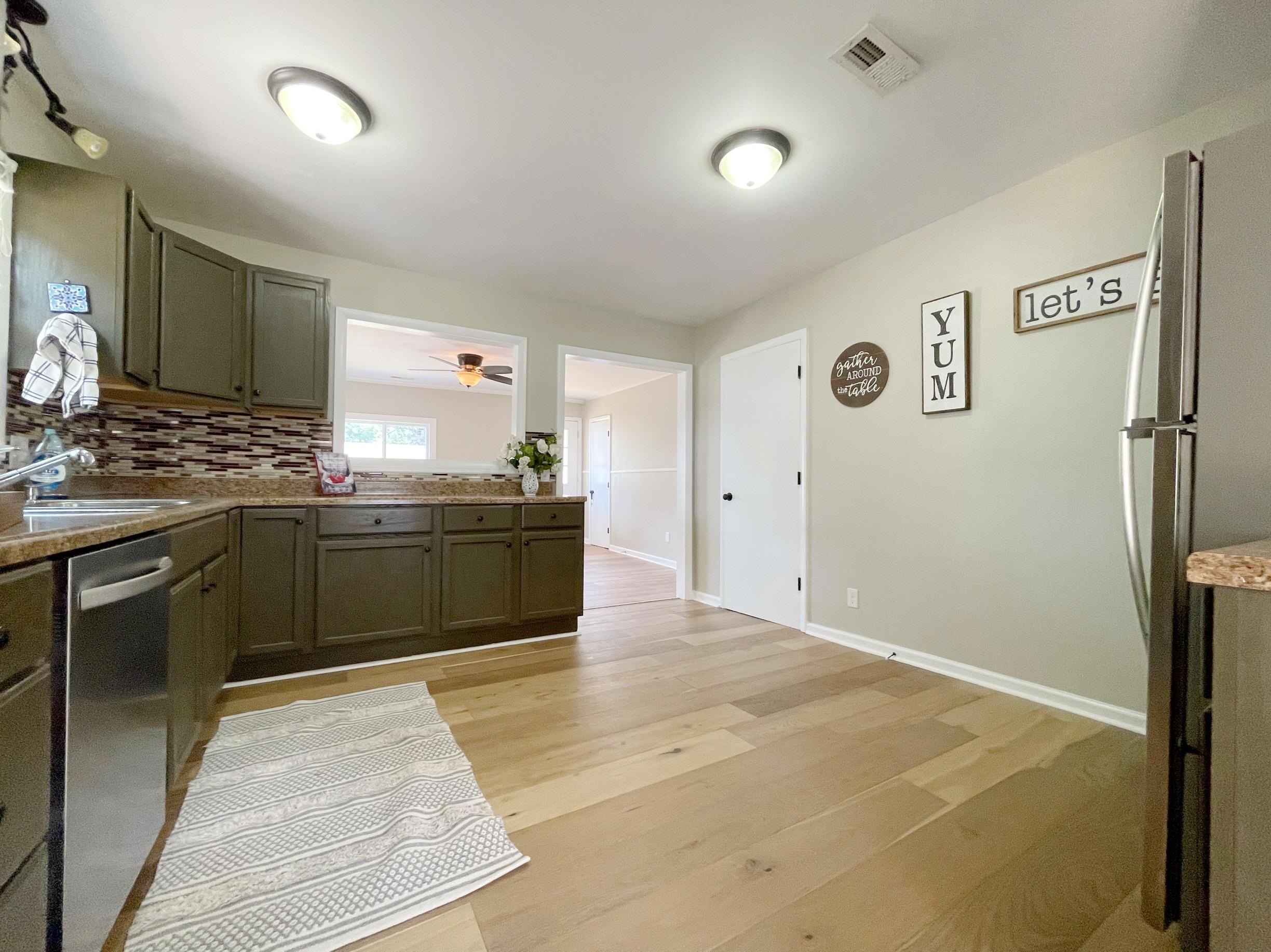 503 5th Street Grottoes, VA 24441 - Photo 15 of 24 a kitchen with stainless steel appliances granite countertop a stove a sink and a refrigerator
