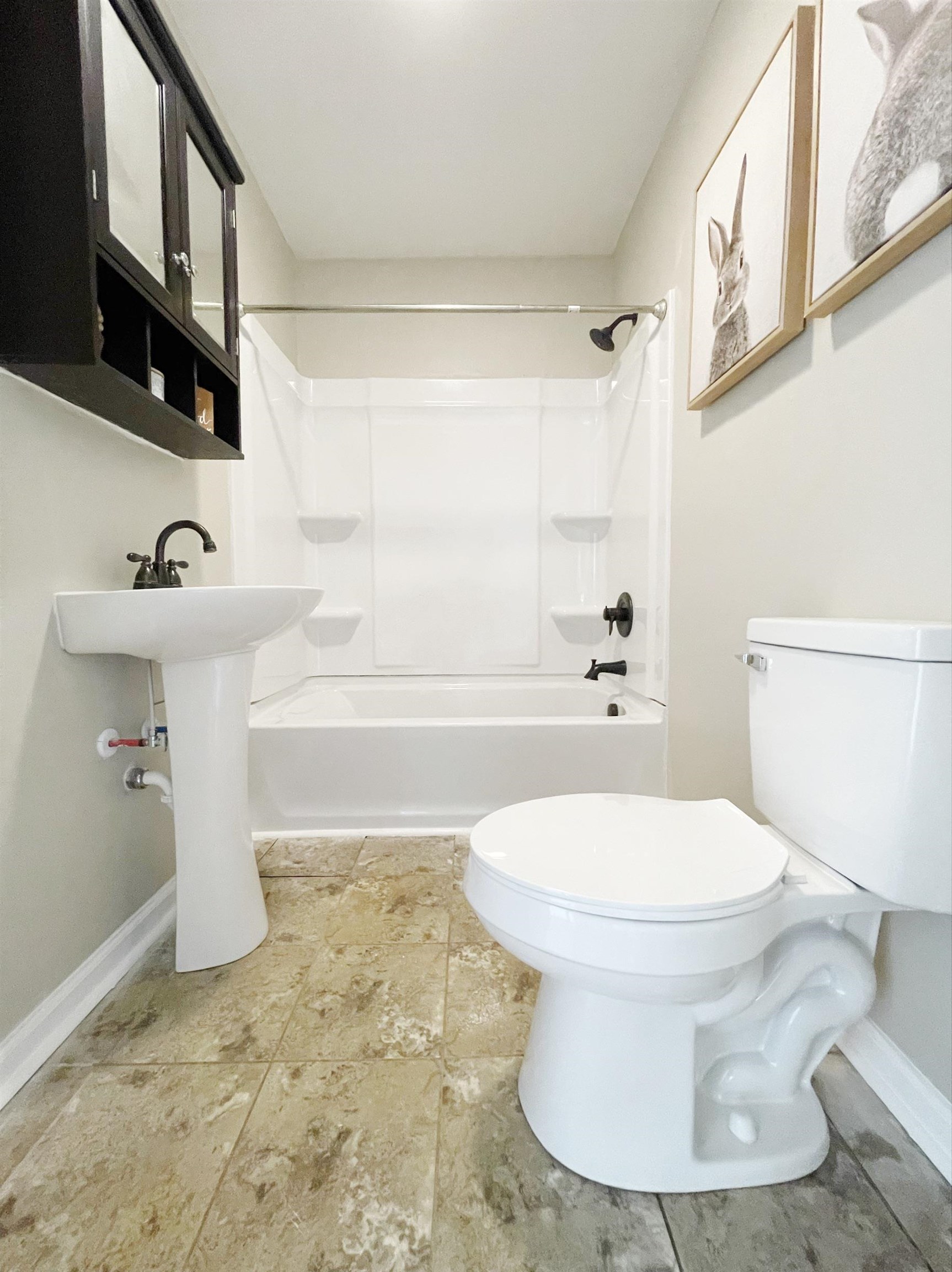 503 5th Street Grottoes, VA 24441 - Photo 24 of 24 a white toilet sitting next to a bathroom sink and tub