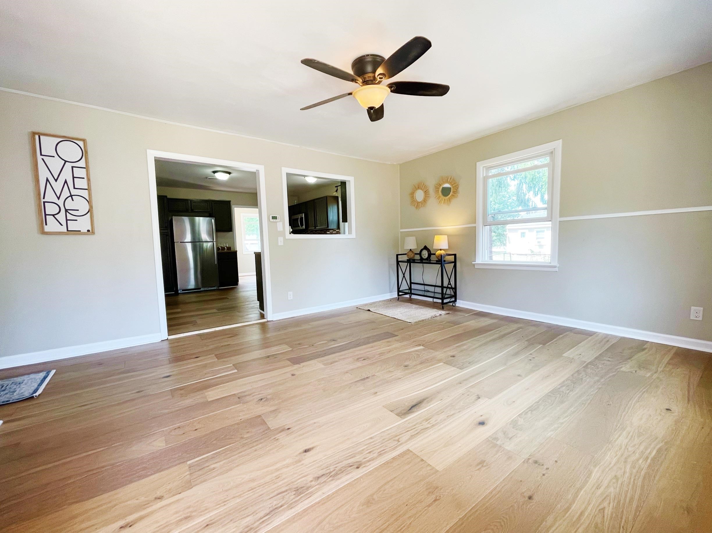 503 5th Street Grottoes, VA 24441 - Photo 10 of 24 a view of an empty room with a window and wooden floor
