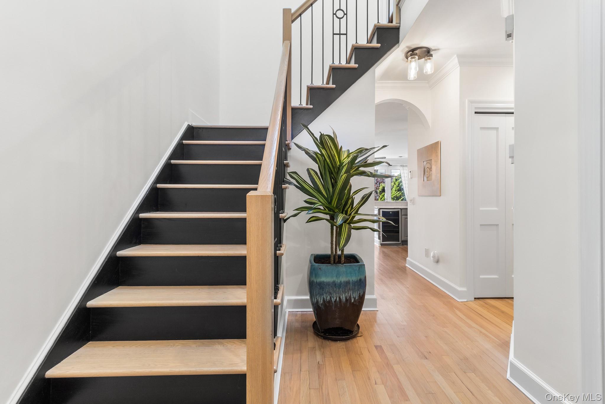 7 Salt Meadow Road, Unit 7 Babylon, NY 11702 - Photo 13 of 35 a view of entryway with wooden floor and stairs