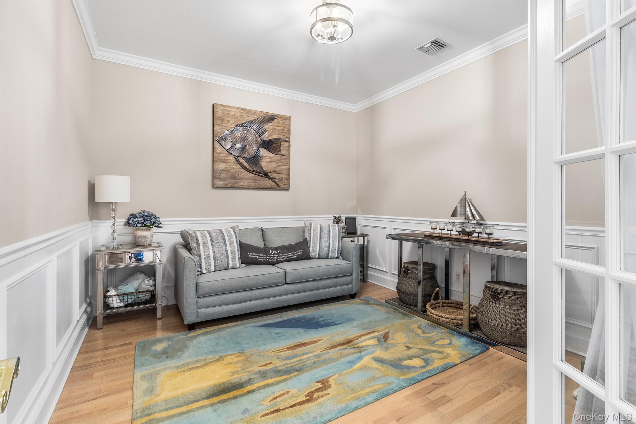 7 Salt Meadow Road, Unit 7 Babylon, NY 11702 - Photo 17 of 35 a living room with furniture and a fireplace