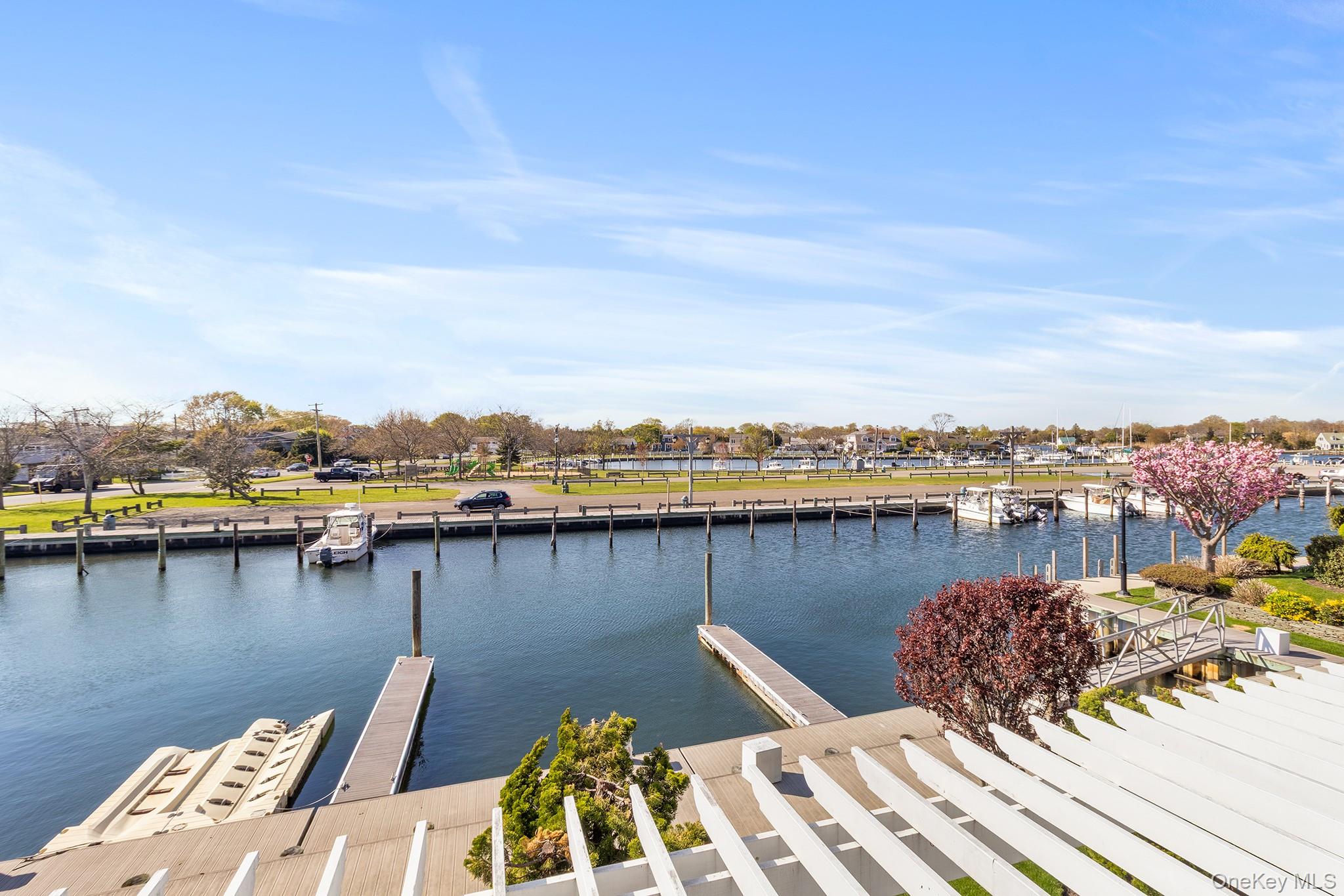 7 Salt Meadow Road, Unit 7 Babylon, NY 11702 - Photo 25 of 35 a view of a lake with city