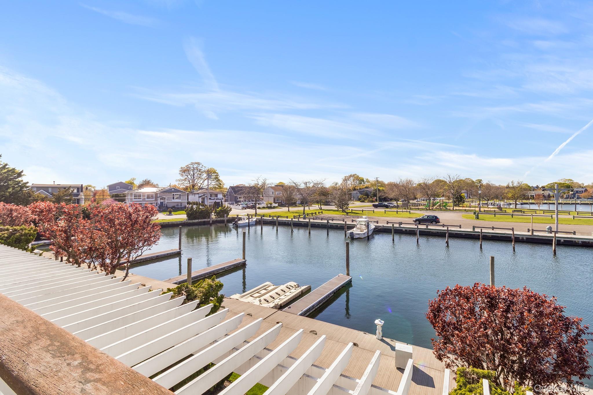 7 Salt Meadow Road, Unit 7 Babylon, NY 11702 - Photo 27 of 35 a view of a lake with outside area
