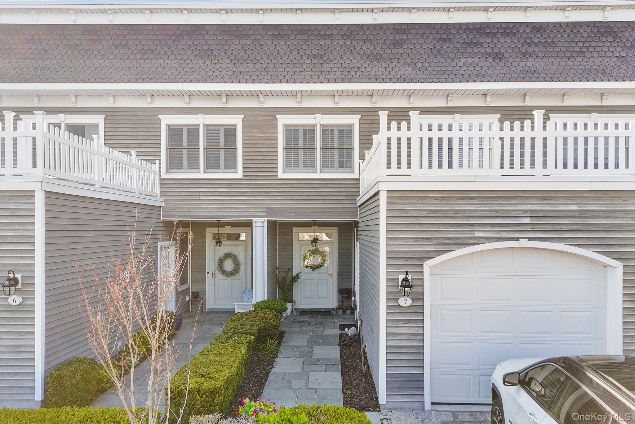 7 Salt Meadow Road, Unit 7 Babylon, NY 11702 - Photo 3 of 35 a view of front door of house with deck