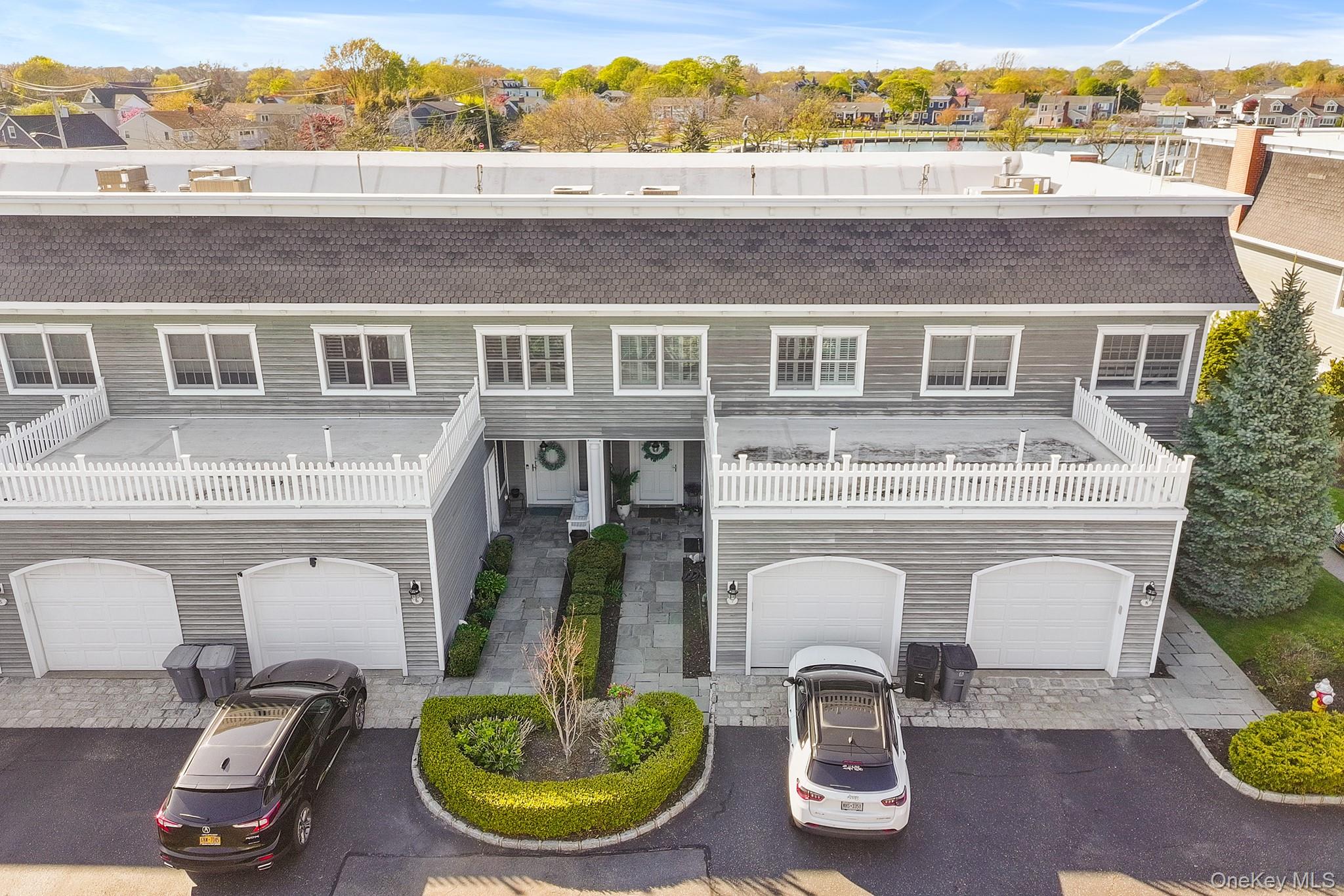 7 Salt Meadow Road, Unit 7 Babylon, NY 11702 - Photo 4 of 35 a front view of a house with balcony