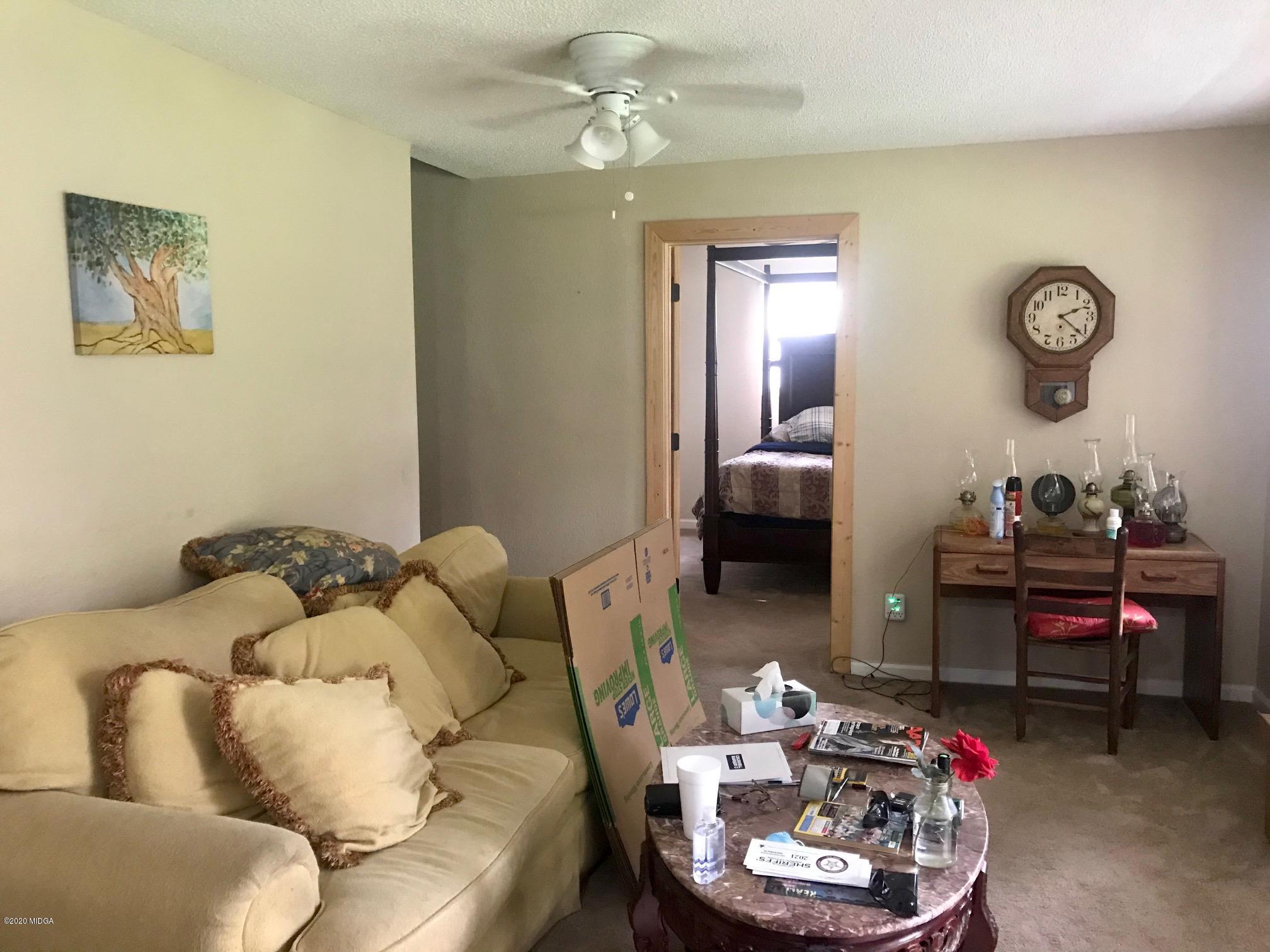 8765 Hopewell Road Lizella, GA 31052 - Photo 2 of 11 a living room with furniture and a mirror