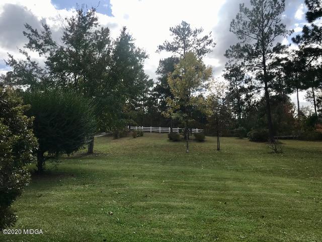 8765 Hopewell Road Lizella, GA 31052 - Photo 11 of 11 a backyard of a house with lots of green space