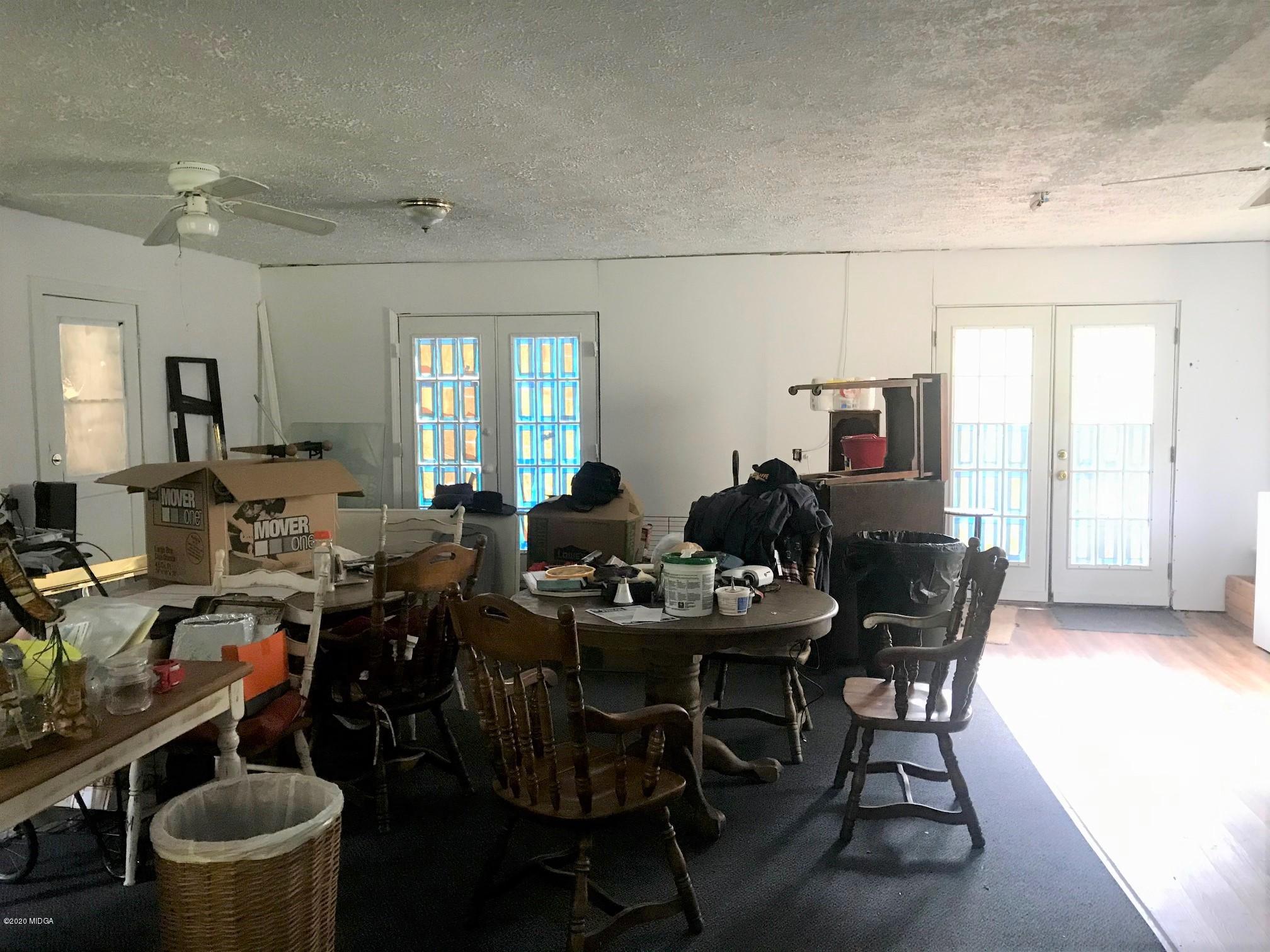 8765 Hopewell Road Lizella, GA 31052 - Photo 5 of 11 a view of a dining room with furniture and window