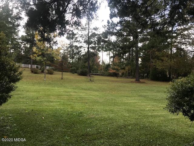 8765 Hopewell Road Lizella, GA 31052 - Photo 9 of 11 a view of outdoor space with deck and yard