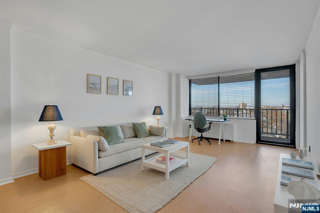 a living room with furniture and a large window