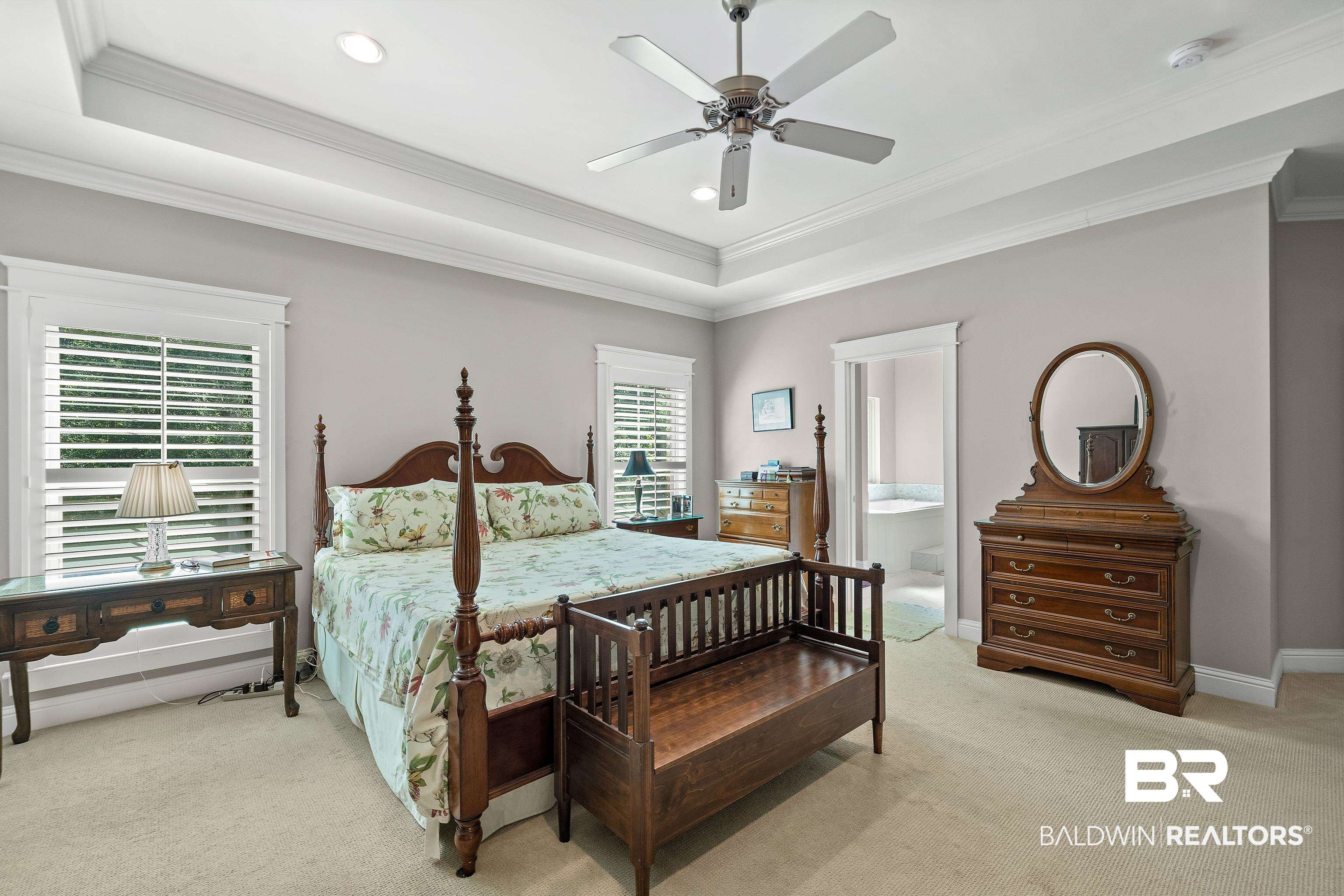 29530 St John Street Daphne, AL 36526 - Photo 15 of 38 Carpeted bedroom featuring ceiling fan, a raised ceiling, crown molding, and ensuite bathroom