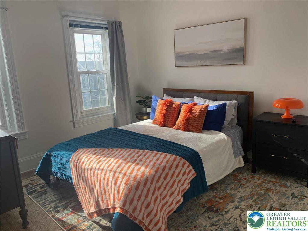 37 Evergreen Street Nazareth, PA 18064 - Photo 17 of 32 a bedroom with a bed and a painting on the wall