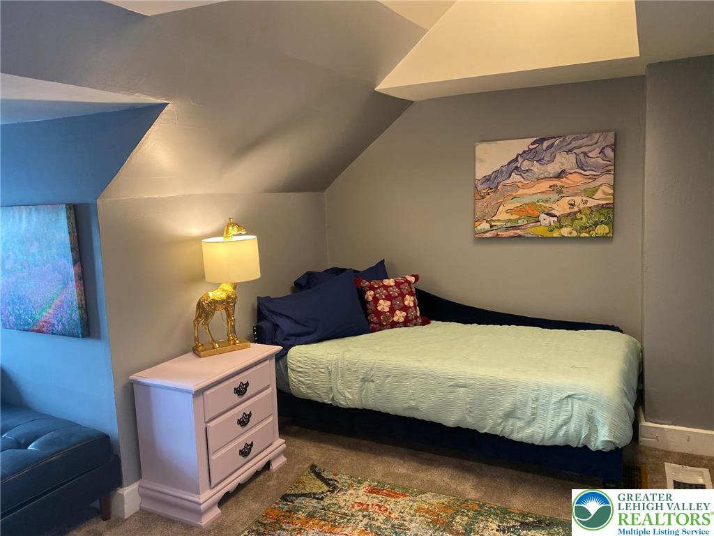 37 Evergreen Street Nazareth, PA 18064 - Photo 20 of 32 a bedroom with a bed and wooden floor