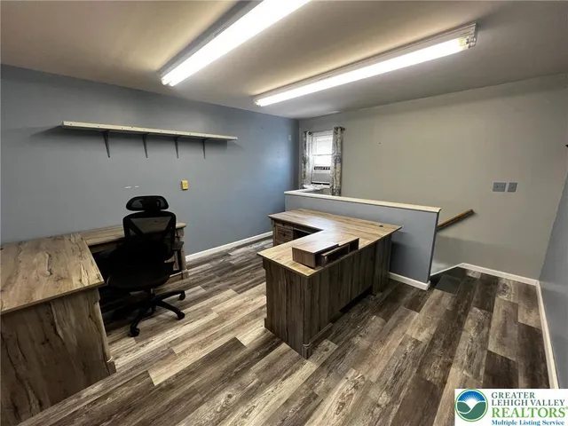 a view of workspace with wooden floor