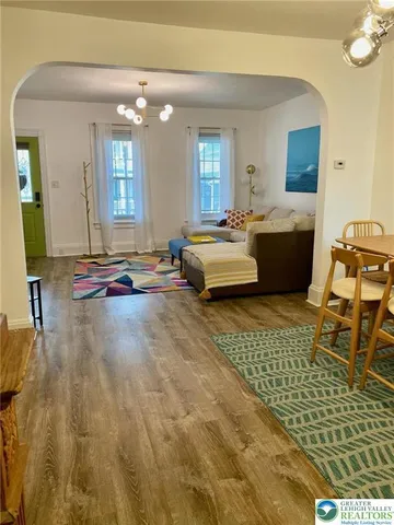 a living room with a couch and chairs