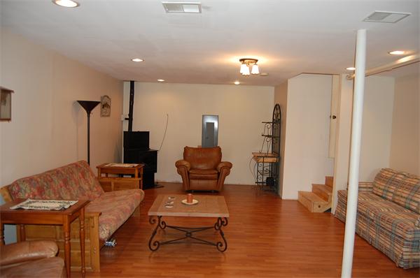 61 Coffey Hill Road Ware, MA 01082 - Photo 11 of 26 a living room with furniture and a wooden floor