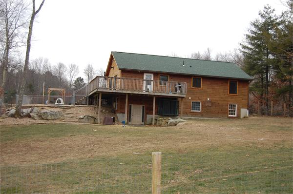 61 Coffey Hill Road Ware, MA 01082 - Photo 2 of 26 a front view of a house with a yard