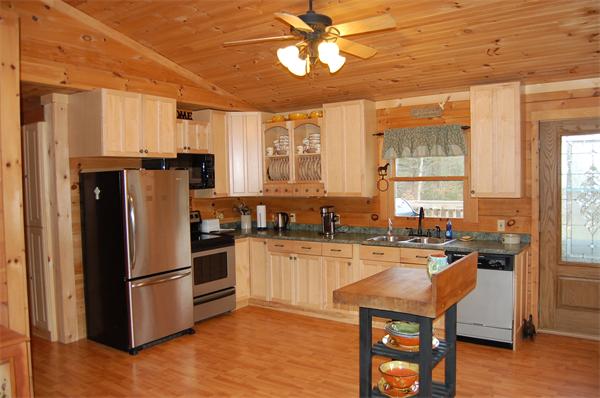 61 Coffey Hill Road Ware, MA 01082 - Photo 3 of 26 a kitchen with stainless steel appliances granite countertop a refrigerator a sink a stove and island